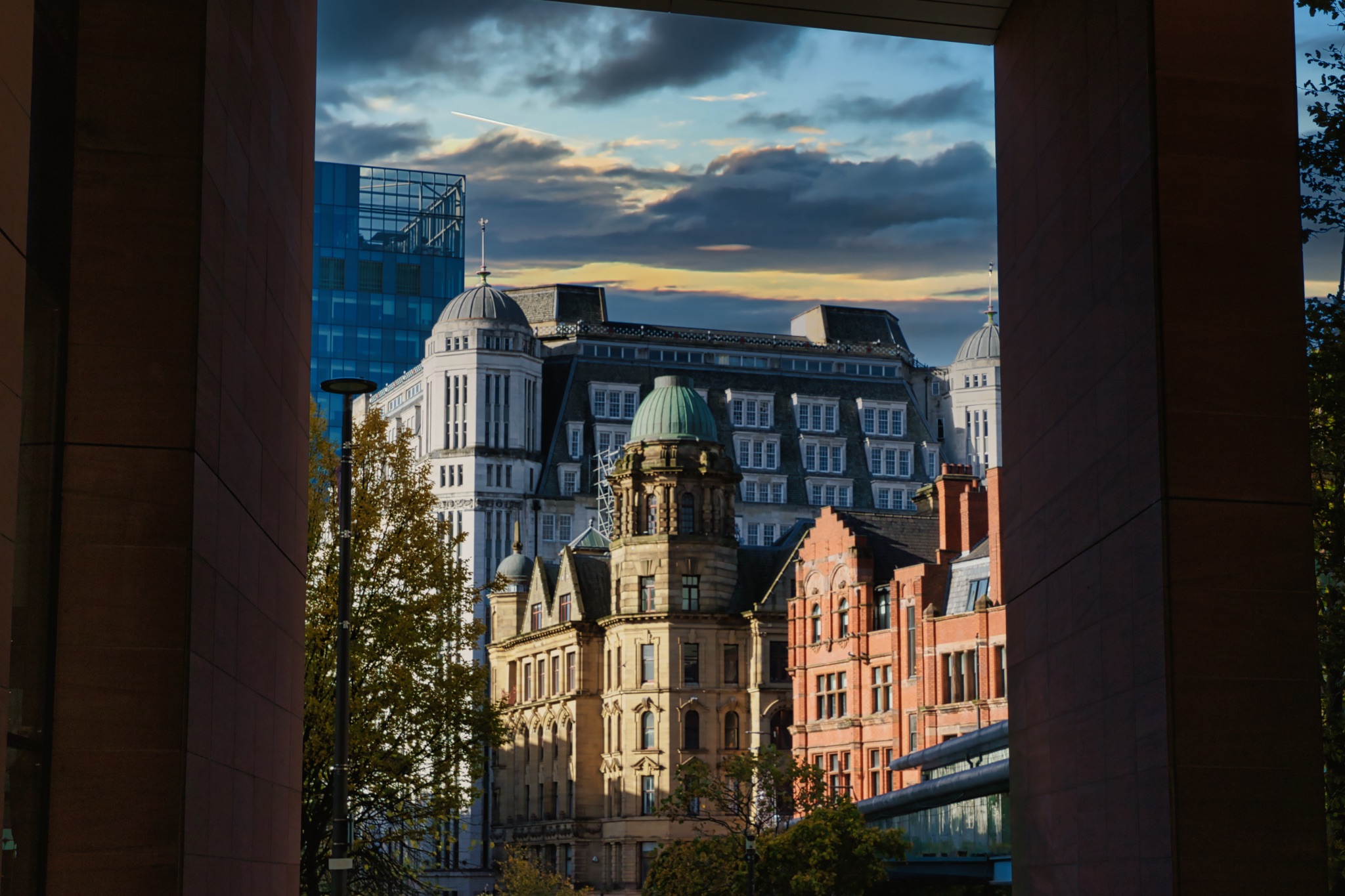 City Buildings Viewed Through an Opening in Manchester, UK.
